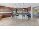 Spacious kitchen with dark cabinetry, granite countertops, and a breakfast bar with seating at , Las Vegas, NV 89149