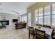 The open-plan living room and dining areas receive abundant natural light from shuttered windows at , Las Vegas, NV 89149