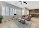 Comfortable living space featuring plantation shutters, tile flooring, and seamless flow to the kitchen area at , Las Vegas, NV 89149