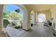 Inviting front porch with decorative columns, hanging plants, and stylish seating area at , Las Vegas, NV 89149