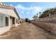 View of the backyard with newly laid dirt and block wall at 10029 Netherton Dr, Las Vegas, NV 89134