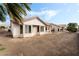 View of the backyard with newly laid dirt and view of the house at 10029 Netherton Dr, Las Vegas, NV 89134
