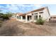 View of the backyard with newly laid dirt and the back of the house at 10029 Netherton Dr, Las Vegas, NV 89134