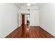 Spacious bedroom showcasing wood flooring and ensuite bathroom access at 10029 Netherton Dr, Las Vegas, NV 89134