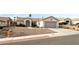 Single-story home featuring a xeriscaped front yard, neutral color palette, and a two car garage at 10029 Netherton Dr, Las Vegas, NV 89134
