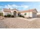 Inviting single-story home featuring desert landscaping, a tile roof, and a welcoming entrance at 10029 Netherton Dr, Las Vegas, NV 89134