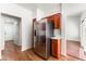 Modern kitchen boasts stainless steel refrigerator and matching wooden cabinets for storage at 10029 Netherton Dr, Las Vegas, NV 89134