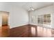 Large, open living area with wood floors, neutral colors, and a sliding glass door to the backyard at 10029 Netherton Dr, Las Vegas, NV 89134