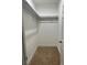 Walk-in closet with shelving and carpeted floor at 1060 Hall Ave, Pahrump, NV 89048