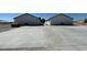 Newly built residential units featuring expansive parking and modern architecture at 1060 Hall Ave, Pahrump, NV 89048