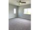 Spacious carpeted bedroom with two windows offering plenty of natural light at 1064 Blue Wine Ct, Henderson, NV 89002