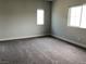 Bright carpeted bedroom with neutral walls and dual windows offering ample natural light at 1064 Blue Wine Ct, Henderson, NV 89002