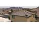 Tan home with mountains in background and a neatly arranged neighborhood at 1064 Blue Wine Ct, Henderson, NV 89002
