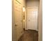 Hallway leading to a bathroom, and closet space; offering ample storage at 1064 Blue Wine Ct, Henderson, NV 89002