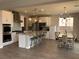 Open concept kitchen and dining area featuring a large island and modern lighting fixtures at 1064 Blue Wine Ct, Henderson, NV 89002