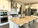 Elegant kitchen with stainless steel appliances, granite countertops, and a tiled backsplash at 1064 Blue Wine Ct, Henderson, NV 89002