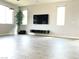 Minimalist living room with sleek entertainment center and large windows offering plenty of natural light at 1064 Blue Wine Ct, Henderson, NV 89002