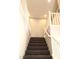 Carpeted staircase with white railing leading to the upper level of the home at 1064 Blue Wine Ct, Henderson, NV 89002