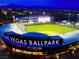 Nighttime view of Las Vegas Ballpark featuring stadium lights and vibrant signage at 10717 Grand Cypress Ave, Las Vegas, NV 89134