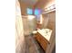 Well-lit bathroom features a shower, vanity, and ceramic tile floors at 10717 Grand Cypress Ave, Las Vegas, NV 89134