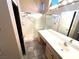 Bright bathroom offering a dual shower, vanity, and tile flooring at 10717 Grand Cypress Ave, Las Vegas, NV 89134