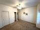 Cozy bedroom with carpet, closet, ceiling fan, and neutral walls at 10717 Grand Cypress Ave, Las Vegas, NV 89134