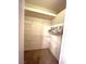 A well-organized closet features white wire shelving for ample storage, plus carpet floors, and plenty of space at 10717 Grand Cypress Ave, Las Vegas, NV 89134