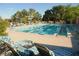 Large community pool with lounge chairs and shaded areas at 10717 Grand Cypress Ave, Las Vegas, NV 89134