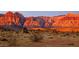 Picturesque desert landscape with rocky mountains and native vegetation at sunset at 10717 Grand Cypress Ave, Las Vegas, NV 89134