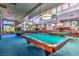 Recreational game room featuring multiple pool tables and decorative lighting at 10717 Grand Cypress Ave, Las Vegas, NV 89134