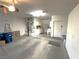 Spacious two-car garage with ample storage and utility sink at 10717 Grand Cypress Ave, Las Vegas, NV 89134