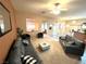 Spacious living room featuring neutral tones, plush seating, and a bright ceiling fan at 10717 Grand Cypress Ave, Las Vegas, NV 89134