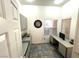 Office space with tile flooring, built in shelves, and large windows at 10717 Grand Cypress Ave, Las Vegas, NV 89134