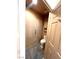 Cozy powder room featuring slate tile flooring and decorative accents at 10717 Grand Cypress Ave, Las Vegas, NV 89134