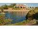 Stunning water view of home overlooking tranquil pond and lush landscaping at 10717 Grand Cypress Ave, Las Vegas, NV 89134