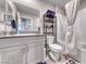 The well-lit bathroom features a single sink vanity and a shower-tub combination with tiled walls at 10979 Bristol Park Ave, Las Vegas, NV 89166
