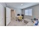 The bedroom offers a well-lit area with a neutral color palette, complete with a couch and desk at 10979 Bristol Park Ave, Las Vegas, NV 89166