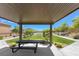 Inviting community picnic area with picnic table and beautifully landscaped surroundings at 10979 Bristol Park Ave, Las Vegas, NV 89166