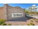 Stone entrance sign for Tribute community with manicured landscaping at 10979 Bristol Park Ave, Las Vegas, NV 89166