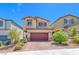 Charming two-story home with landscaped yard and brick driveway in a suburban neighborhood at 10979 Bristol Park Ave, Las Vegas, NV 89166