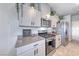 Kitchen featuring stainless steel appliances, granite countertops, and light gray cabinets at 10979 Bristol Park Ave, Las Vegas, NV 89166