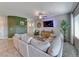 Spacious living room featuring modern decor, neutral tones, and ample natural light at 10979 Bristol Park Ave, Las Vegas, NV 89166