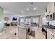 Open-concept kitchen with island overlooks dining area and spacious living room, perfect for entertaining at 10979 Bristol Park Ave, Las Vegas, NV 89166