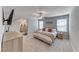 Spacious main bedroom with ensuite bathroom, bright windows, and plush carpet at 10979 Bristol Park Ave, Las Vegas, NV 89166