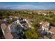 High-angle shot showcasing the neighborhood, beautiful desert landscaping, and the pool at 11830 Kingsbarns Ct, Las Vegas, NV 89141