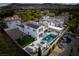 Expansive aerial shot highlighting the house, pool area, and lush green lawn at 11830 Kingsbarns Ct, Las Vegas, NV 89141