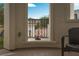View from the covered balcony showing decorative wrought iron railing and outdoor chair at 11830 Kingsbarns Ct, Las Vegas, NV 89141