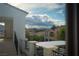 Exterior shot of the neighborhood featuring tile roofs, mature landscaping, and mountain views at 11830 Kingsbarns Ct, Las Vegas, NV 89141
