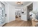 Bright foyer with hardwood floors, designer lighting, and views of the living and exercise rooms at 11830 Kingsbarns Ct, Las Vegas, NV 89141