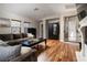 Inviting living room featuring hardwood floors, a comfortable sofa, and ample natural light at 11830 Kingsbarns Ct, Las Vegas, NV 89141